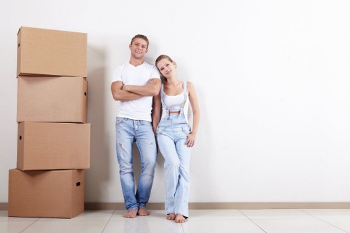 Moving van loading safely with protective covers and straps
