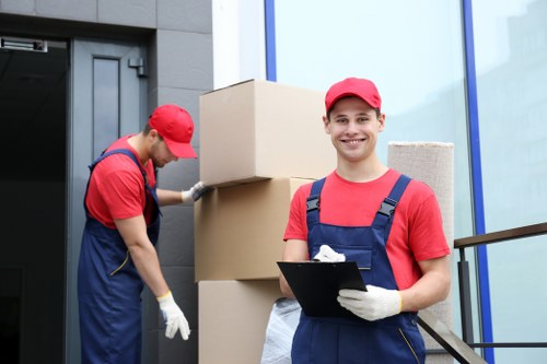 Moving van and helper loading household items