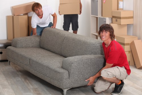 Packed moving boxes and furniture inside a Redbridge home