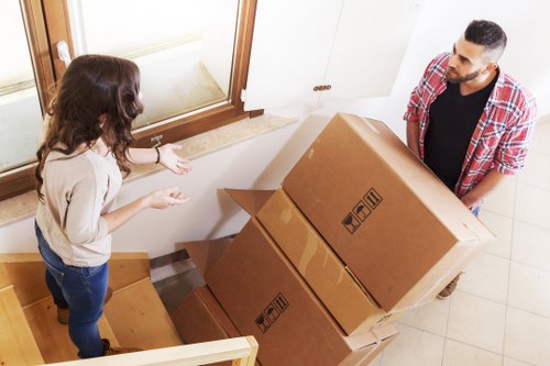 Furniture and boxes being loaded into a van