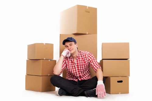 Removalists carrying household items in a Redbridge street